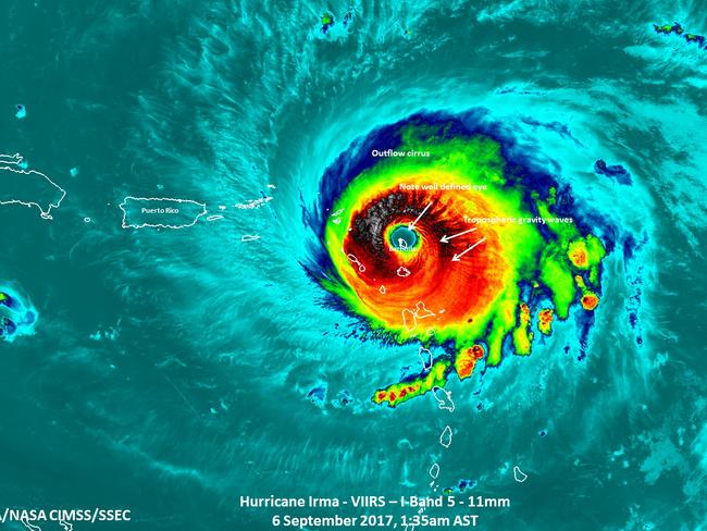 At least seven are dead as historic Category 5 Hurricane Irma charts its path towards Florida. Pictured, Irma passing over the island of Barbuda. Picture: NASA/NOAA/UWM-CIMSS, William Straka III