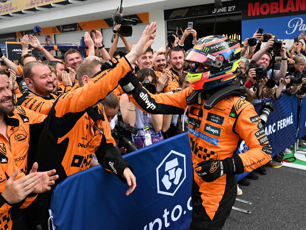 McLaren's Australian driver Oscar Piastri celebrates. Photo by CHANDAN KHANNA / AFP.