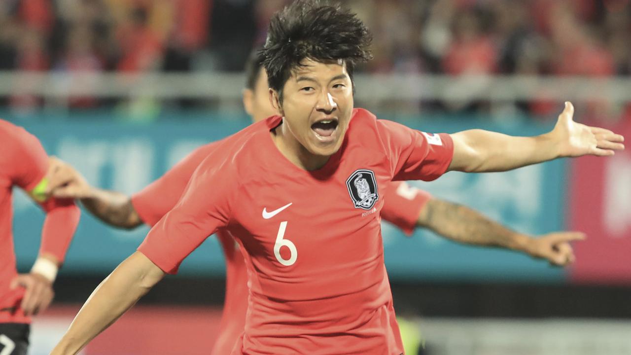 South Korea's Hwang Hee-chan, right, celebrates. (Han Jong-chan/Yonhap via AP)