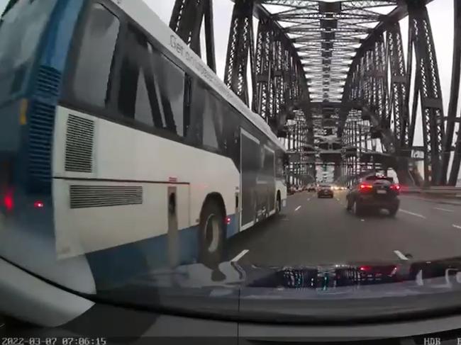 The black SUV (right) seen driving in the wrong lane in the video seconds before the crash.