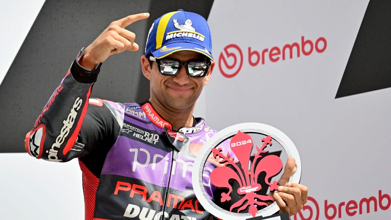 Ducati Spanish rider Jorge Martin celebrates his third place on the podium of the Italian MotoGP race at Mugello on June 2, 2024. (Photo by Marco BERTORELLO / AFP)