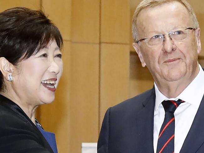 Tokyo Gov. Yuriko Koike, left, meets International Olympic Committee member John Coates in Tokyo Friday, Oct. 25, 2019. The IOC released a proposal a week ago to move the marathons and race walking events to Sapporo. (Shinji Kita/Kyodo News via AP)