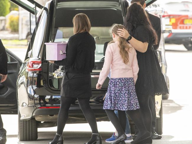 The children’s mother and daughter at the funeral at Pinegrove Memorial Park. Picture: Jeremy Piper