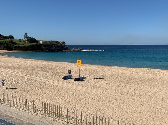 An empty Coogee beach after lifeguards cleared the sand today. Picture: Wendy Fitzgibbon