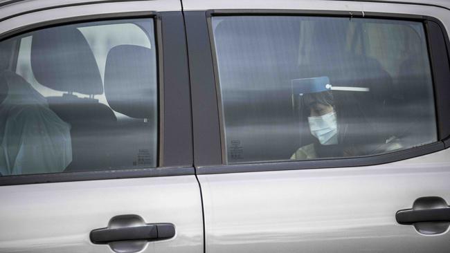 Sarah Caisip leaves Mount Gravatt Cemetery after viewing her father’s body. Picture: Glenn Hunt