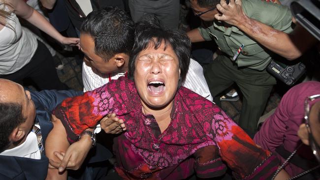 The relative of one of the crash victims breaks down  Kuala Lumpur International Airport.