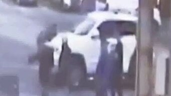 CCTV shows the man clinging to the car. Picture: Channel Ten