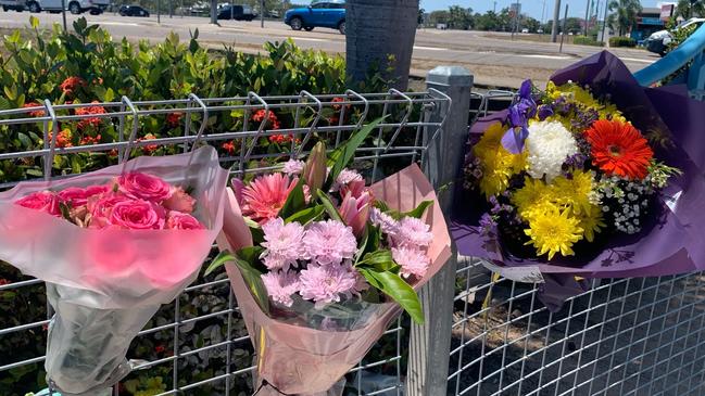 Floral tributes after 15-year-old girl an e-scooter was killed in an accident at an intersection of the Bruce Highway and Deeragun Rd at Deeragun. Photo: Jami Roberts