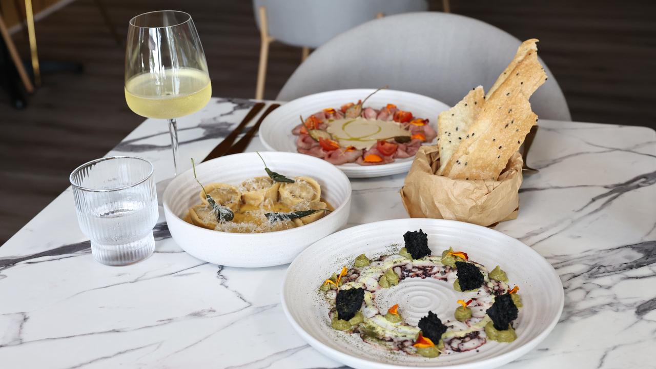 A new restaurant and adjoining bar have opened in the Drift apartment building at Palm Cove, opposite Miguel's tapas restaurant. Ignis restaurant's vitello tonnato, the hand made butter sage pasta and the octopus carpaccio. Picture: Brendan Radke