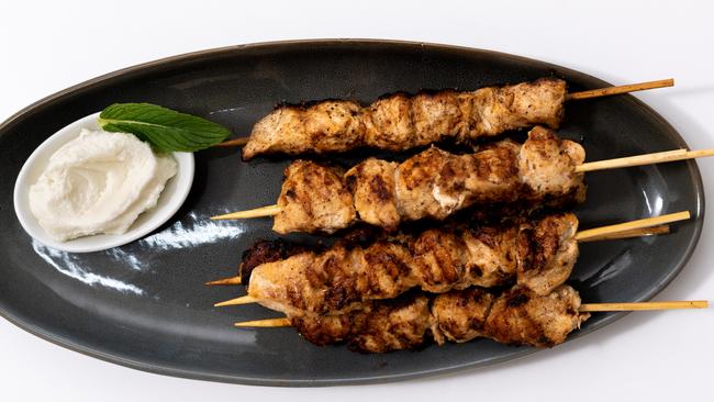 Barbecue chicken tawook skewers with that delicious staple, garlic dip. Picture: Monique Harmer