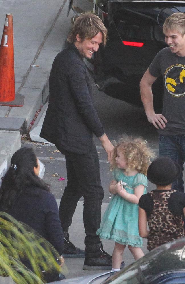 Hello daddy ... Faith Margaret joins her dad on the set of American Idol. Picture: Splash Media