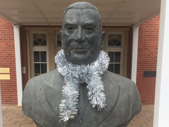 Robert Menzies bust gets the Christmas treatment outside Menzies House, Canberra. Picture: Rosie Lewis