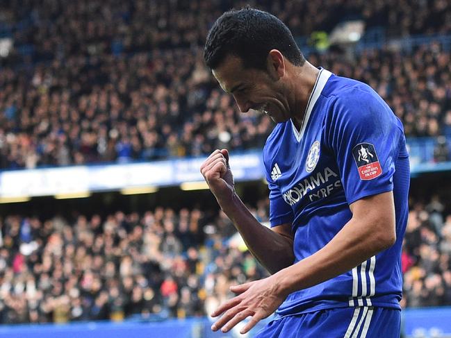 Chelsea's Spanish midfielder Pedro celebrates scoring their second goal during the English FA Cup fourth round football match between Chelsea and Brentford at Stamford Bridge in London on January 28, 2017. / AFP PHOTO / Glyn KIRK / RESTRICTED TO EDITORIAL USE. No use with unauthorized audio, video, data, fixture lists, club/league logos or 'live' services. Online in-match use limited to 75 images, no video emulation. No use in betting, games or single club/league/player publications. /