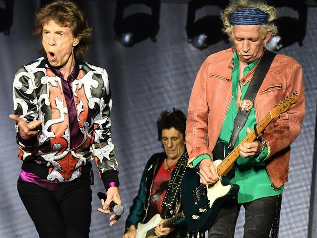 TOPSHOT - (L/R): British musicians Mick Jagger, Ronnie Wood and Keith Richards of The Rolling Stones perform during a concert at The Velodrome Stadium in Marseille on June 26, 2018, as part of their 'No Filter' tour. / AFP PHOTO / Boris HORVAT