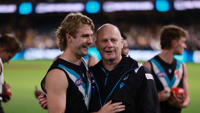 ADELAIDE, AUSTRALIA - SEPTEMBER 13: Jason Horne-Francis and Ken Hinkley of the Power celebrate their win during the 2024 AFL Second Semi Final match between the Port Adelaide Power and the Hawthorn Hawks at Adelaide Oval on September 13, 2024 in Adelaide, Australia. (Photo by James Elsby/AFL Photos via Getty Images)