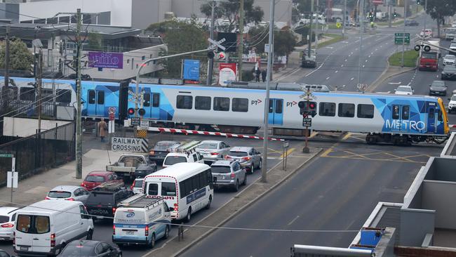 Traffic banked up at the Bell St level crossing. Picture: George Salpigtidis