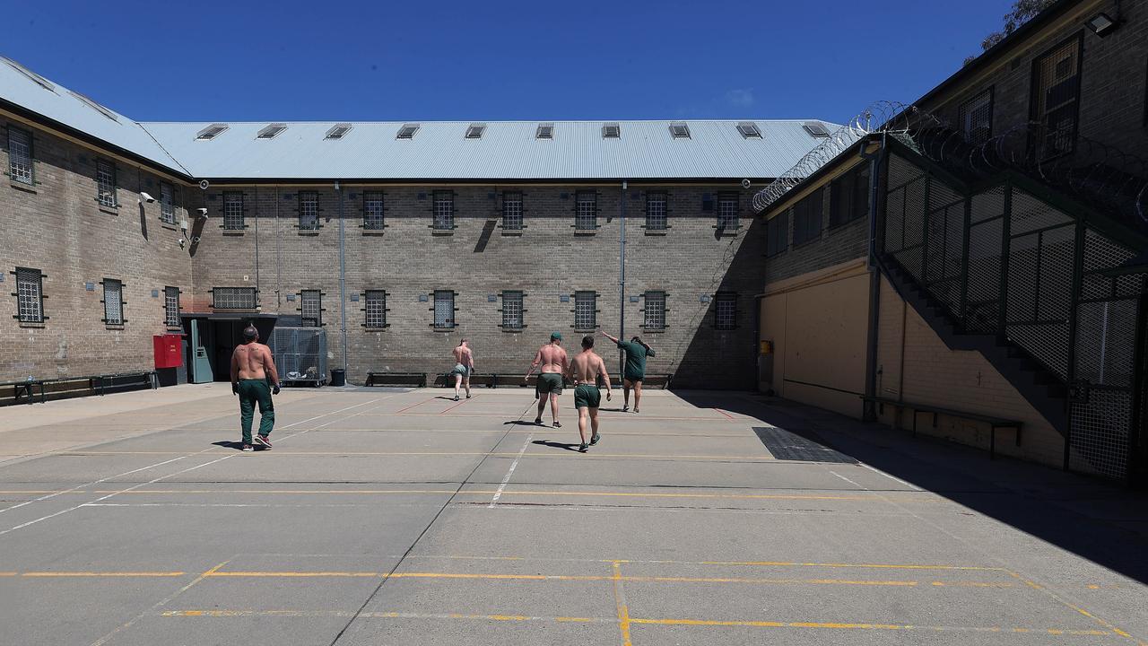 Inmates exercise in the prison yard. Picture: Gary Ramage