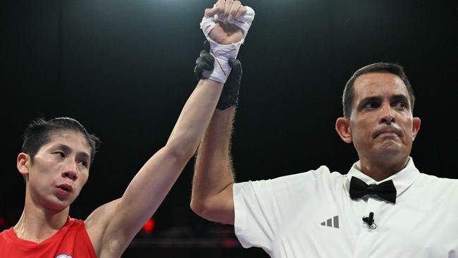 Taiwan's Lin Yu-ting is declared victorious at the end of her fight against Uzbekistan's Sitora Turdibekova. Picture: AFP