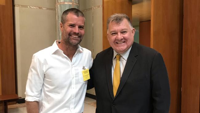 Pete Evans and Craig Kelly pose in Parliament House.