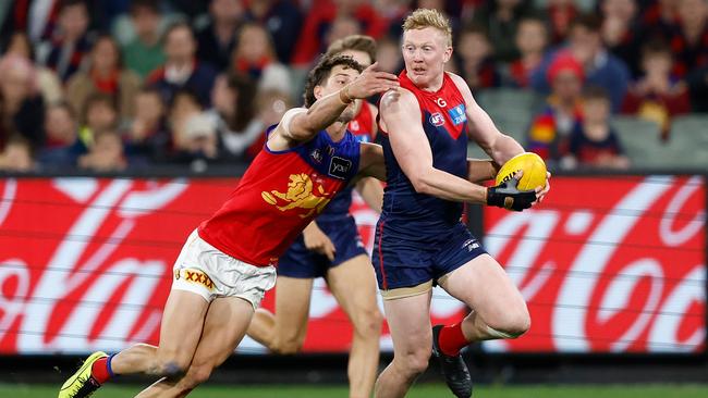 Clayton Oliver had to wear a protective glove against Brisbane and struggled for impact as he managed the discomfort. Picture: Michael Willson / Getty Images