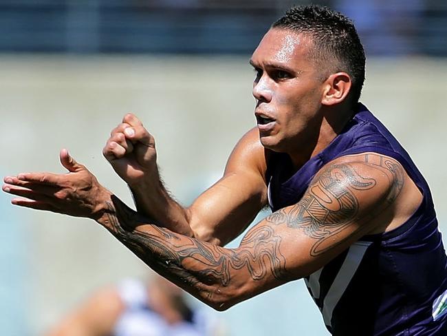 PERTH, AUSTRALIA - MARCH 12: Harley Bennell of the Dockers handballs during the 2016 NAB Challenge match between the Fremantle Dockers and the Geelong Cats at Domain Stadium, Perth on March 12, 2016. (Photo by Will Russell/AFL Media/Getty Images)