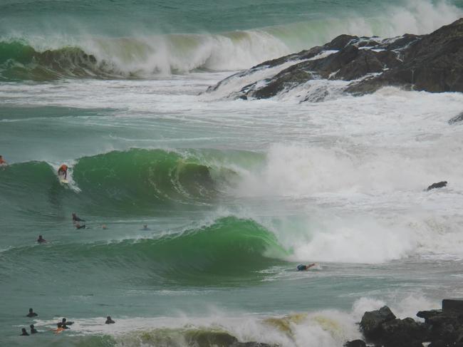 Surfers risking it near the jetty at Coffs Harbour on Tuesday. Picture: Facebook/ Heath Stephen Werner.