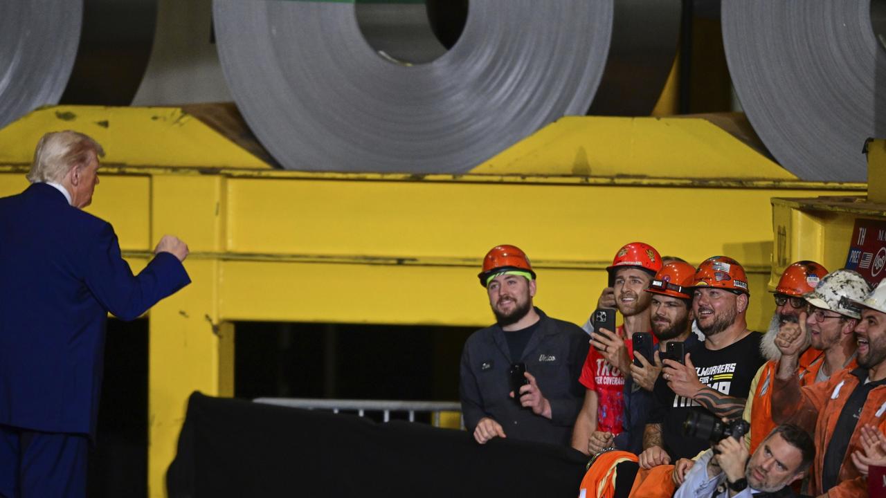President Trump fist pumps as steel workers applaud after speaking at a US steel works plant in West Mifflin, Pennsylvania. Picture: David Dermer / AP Photo