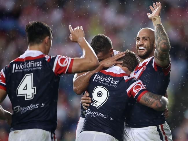 SYDNEY, AUSTRALIA - APRIL 25:  Joseph Manu, Kane Evans and Jake Friend of the Roosters congratulate Blake Ferguson of the Roosters as he celebrates scoring a try during the round eight NRL match between the Sydney Roosters and the St George Illawarra Dragons at Allianz Stadium on April 25, 2017 in Sydney, Australia.  (Photo by Mark Kolbe/Getty Images)