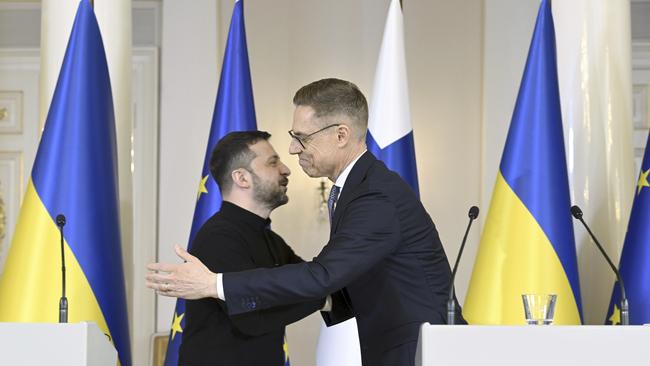 Finland's President Alexander Stubb, right and Ukrainian President Volodymyr Zelenskyy hug at the end of a joint press conference. Picture: AFP