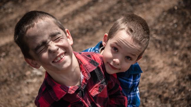 Adorable twins Jayden and Rhys keep their parents smiling even after losing their property to fire. Picture: Jason Edwards