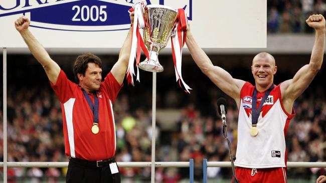 Paul Roos and Barry Hall lift the cup after the 2005 Grand Final.