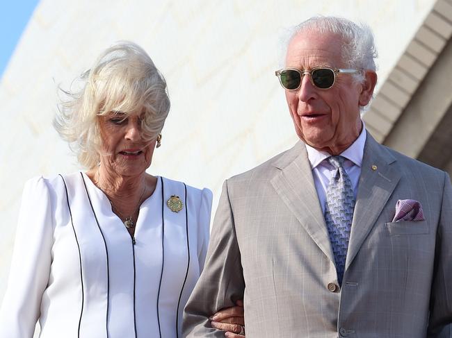 SYDNEY, AUSTRALIA - OCTOBER 22: King Charles III and Queen Camilla walk down the steps at the Sydney Opera House on October 22, 2024 in Sydney, Australia. The King's visit to Australia is his first as monarch, and the Commonwealth Heads of Government Meeting (CHOGM) in Samoa will be his first as head of the Commonwealth. (Photo by Chris Jackson/Getty Images)