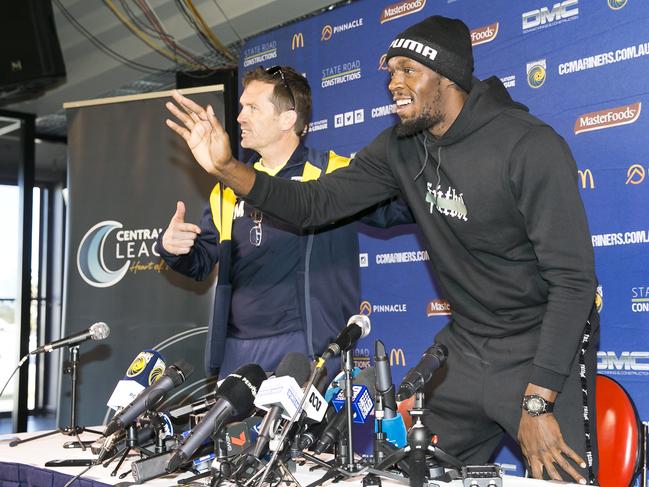 Bolt and coach Mike Mulvey do their double act for the media. Picture: Dylan Robinson