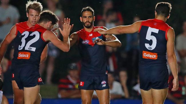 Melbourne players celebrate a goal during their 26-point win. Picture: Getty