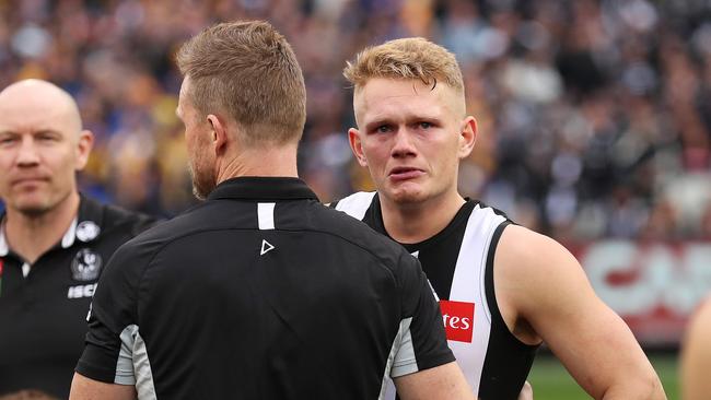 Buckley consoling Adam Treloar after the Grand Final. Picture. Phil Hillyard