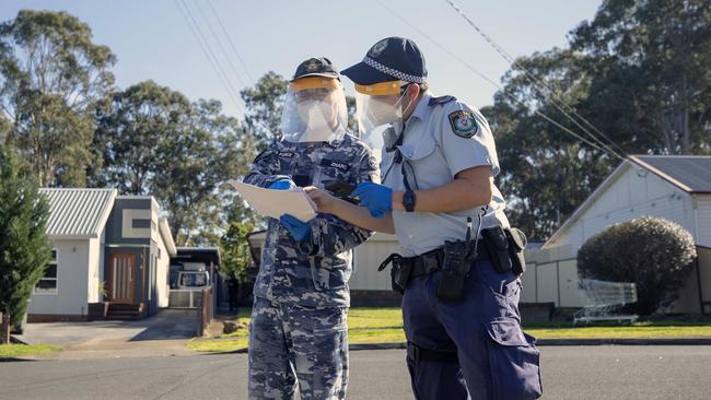 An ADF-police compliance check in Edensor Park, Sydney. Picture: Liam Mendes