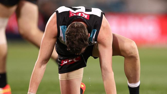 Orazio Fantasia struggles to his feet after taking a bump to the face. Picture: Getty Images