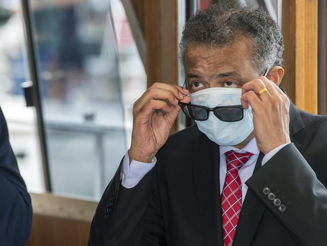 WHO Director-General Tedros Adhanom Ghebreyesus puts on a face mask after a public ceremony. Picture: AP.