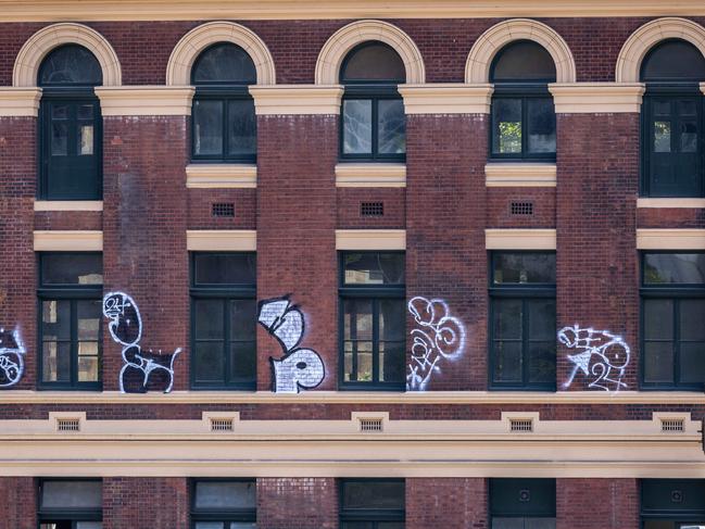 Black and white graffiti ruins the Flinders Street Station facade. Picture: Jason Edwards