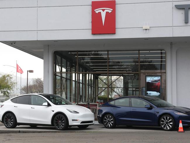 CORTE MADERA, CALIFORNIA - DECEMBER 20: Tesla models Y and 3 are displayed at a Tesla dealership on December 20, 2024 in Corte Madera, California. Electric car maker Tesla is recalling 700,000 vehicles over a tire pressure warning system that could fail to warn drivers of low tire pressure. 2024 Cybertrucks, 2017-2025 Model 3 and 2020-2025 Model Y are being recalled.   Justin Sullivan/Getty Images/AFP (Photo by JUSTIN SULLIVAN / GETTY IMAGES NORTH AMERICA / Getty Images via AFP)