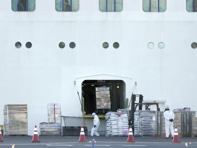 Staff load supplies to the cruise ship Diamond Princess. Cases of the deadly coronavirus on-board have increased. Picture: AP