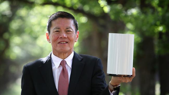 Former Optus chief executive Allen Lew with the Optus 5G home broadband device at its launch in Canberra in 2019.