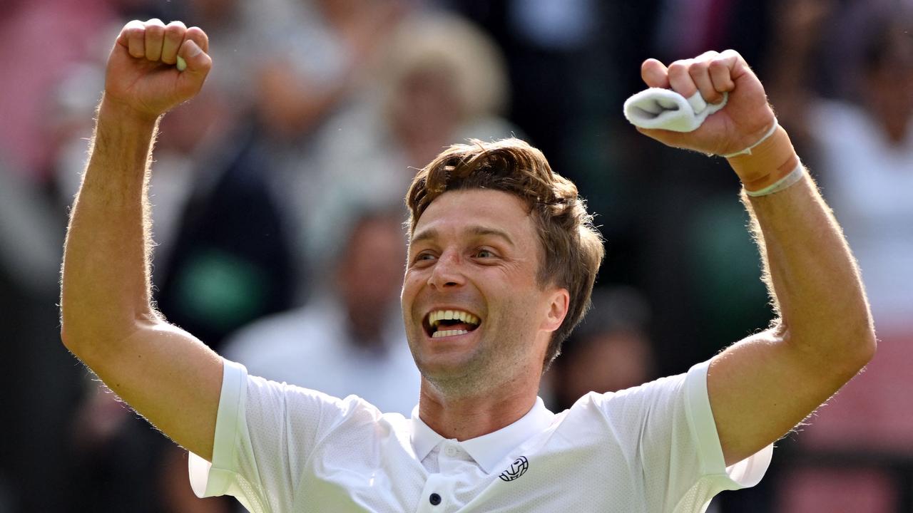 Britain's Liam Broady celebrates beating Norway's Casper Ruud after winning their men's singles tennis match on the fourth day of the 2023 Wimbledon Championships at The All England Tennis Club in Wimbledon, southwest London, on July 6, 2023. (Photo by Glyn KIRK / AFP) / RESTRICTED TO EDITORIAL USE
