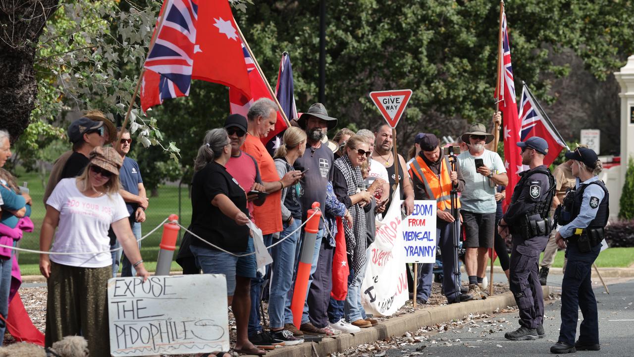 The red ensign flags that have become a familiar sight at freedom protests were once again present, as were a couple of signs, including one reading “expose the pedophiles (sic)”. Picture: Toby Zerna