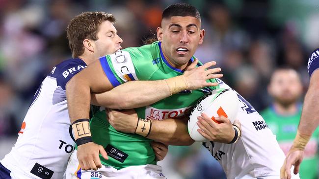 CANBERRA, AUSTRALIA - JUNE 14: Emre Guler of the Raiders is tackled during the round 15 NRL match between Canberra Raiders and North Queensland Cowboys at GIO Stadium, on June 14, 2024, in Canberra, Australia. (Photo by Mark Nolan/Getty Images)