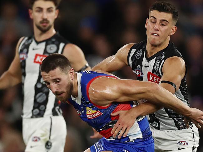 MELBOURNE - July 7 : AFL.   Bulldog Marcus Bontempelli battles with Nick Daicos of the Magpies during the round 17 AFL match between Western Bulldogs and Collingwood at Marvel Stadium  on July 7, 2023.  Photo by Michael Klein.