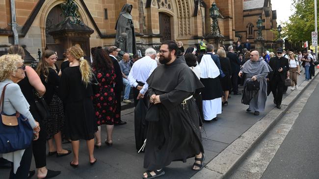 Guests line up to attend the funeral of Cardinal George Pell at St Mary's Cathedral. Picture: NCA NewsWire / Jeremy Piper