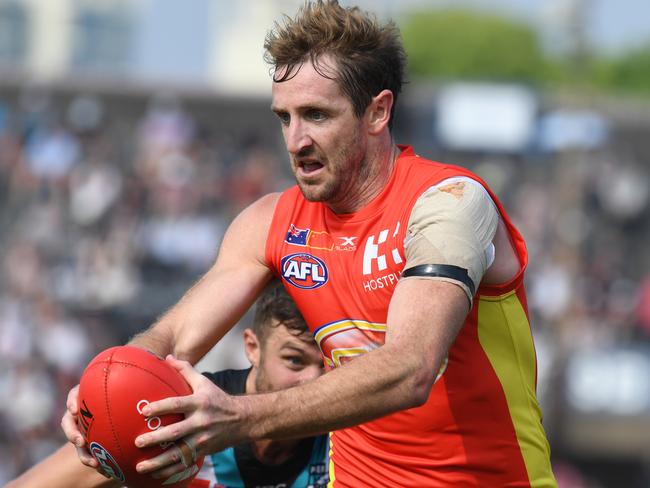 Michael Barlow of the Suns with the ball during the round 8 AFL match between the Gold Coast Suns and the Port Adelaide Power at Jiangwan Stadium in Shanghai, China, Sunday, May 14, 2017. (AAP Image/Tracey Nearmy) NO ARCHIVING, EDITORIAL ONLY