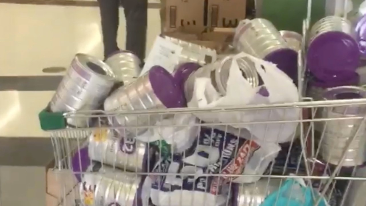 Shoppers filmed loading trolleys with baby formula