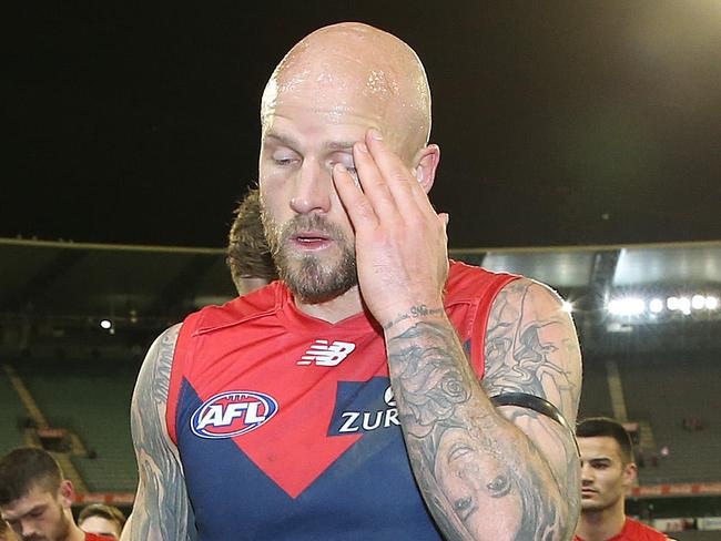 AFL Round 22. 16/08/2019. Melbourne v Sydney at the MCG .  A disappointed Melbourne outfit trudge off the MCG after tonights loss   . Pic: Michael Klein